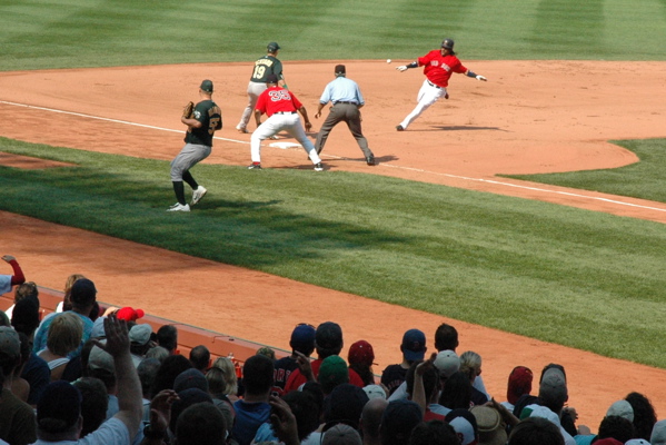 Kotsay nails Ramirez at third.